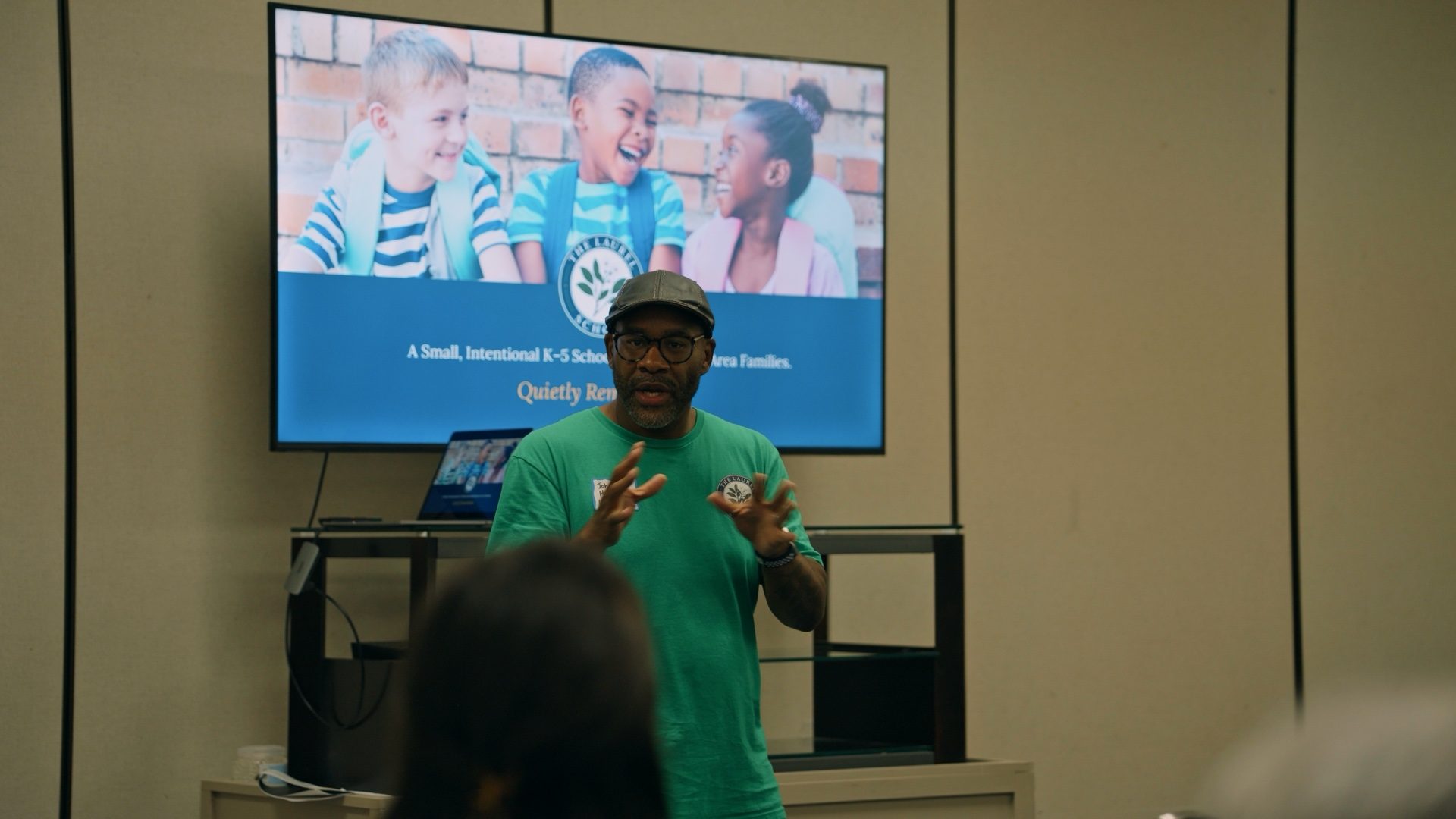 Dr. Johnathan G. Harris speaking with families at a Laurel School information session