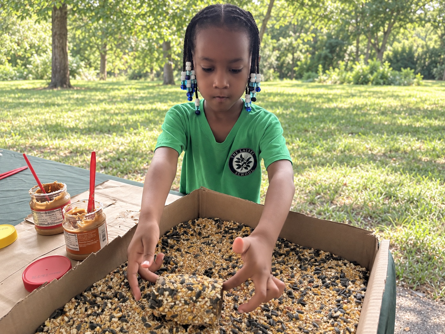 A Laurel School student making a bird feeder at the James River EcoFest